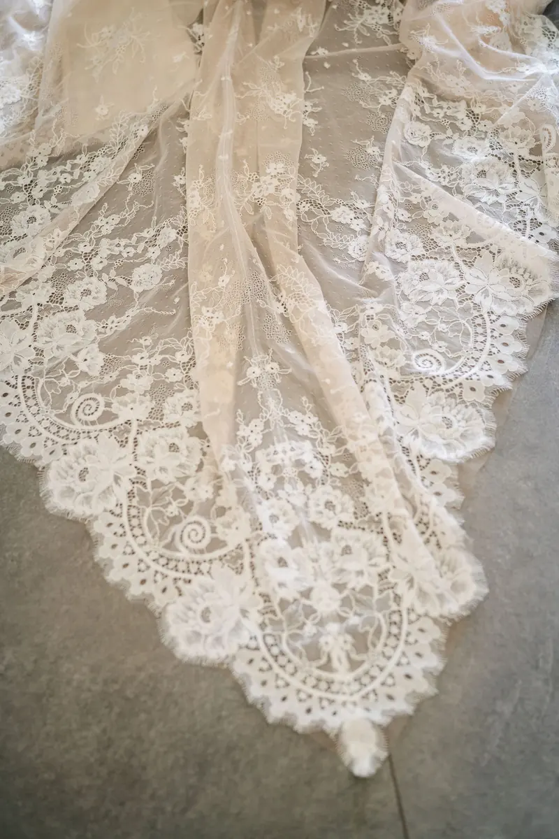 Close-up of the lace train of Sara's gown