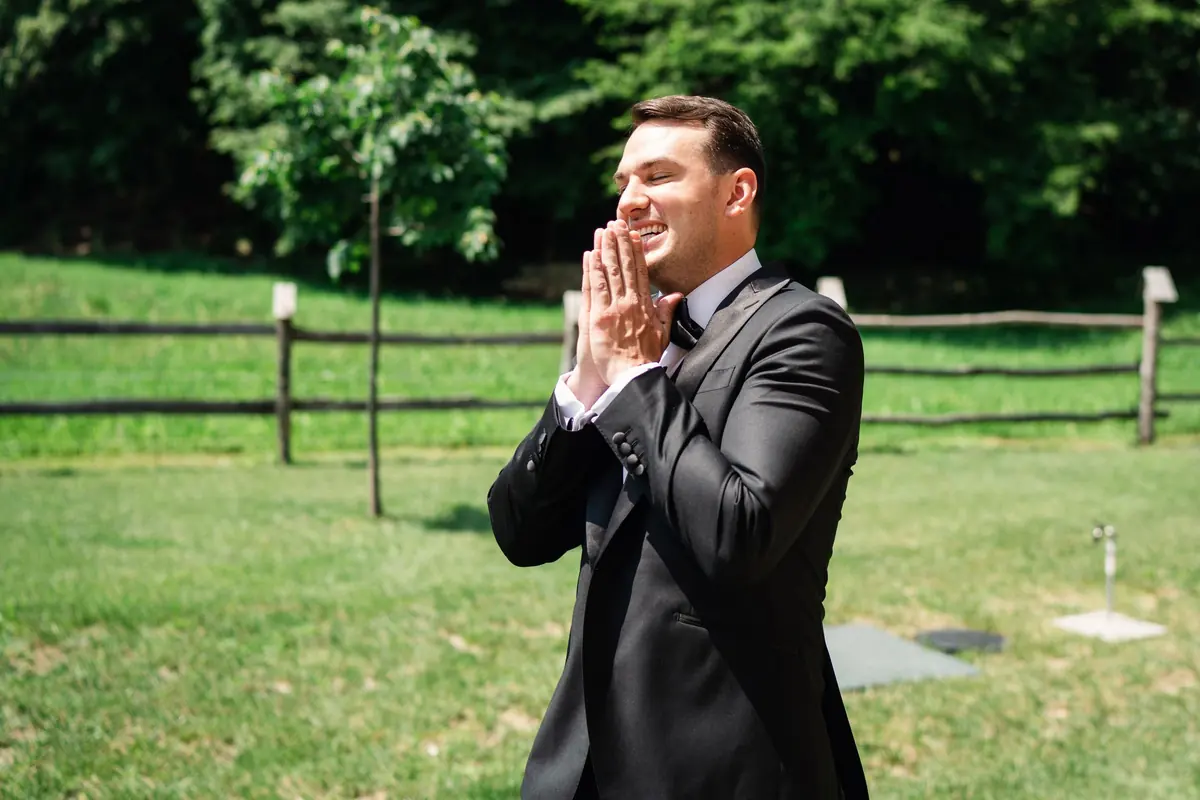 Drew with his hands to his face, seeing Sara for the first time