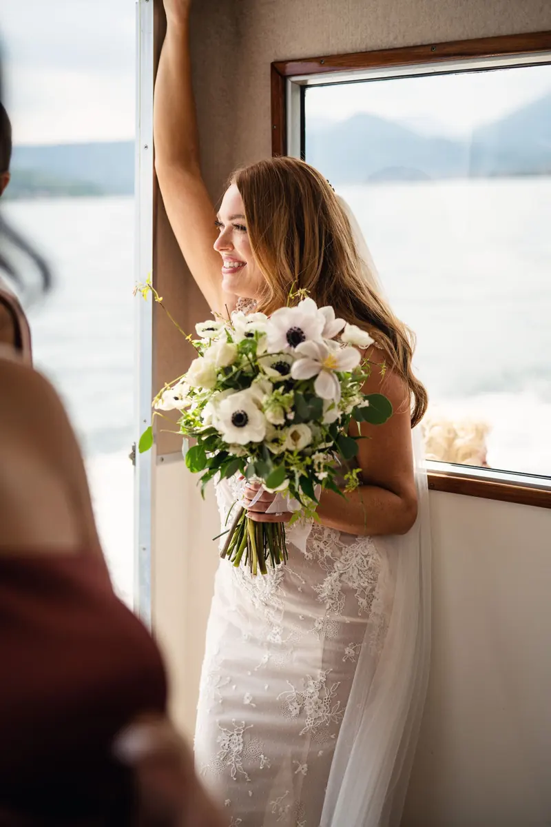Sara at the boat window, looking out over Lake Garda