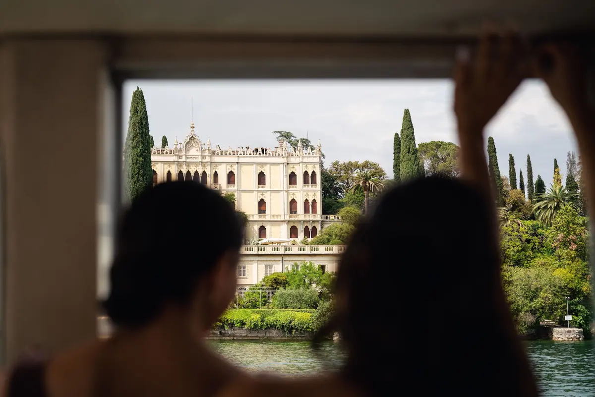 Bridesmaids at the boat window as the island comes into view