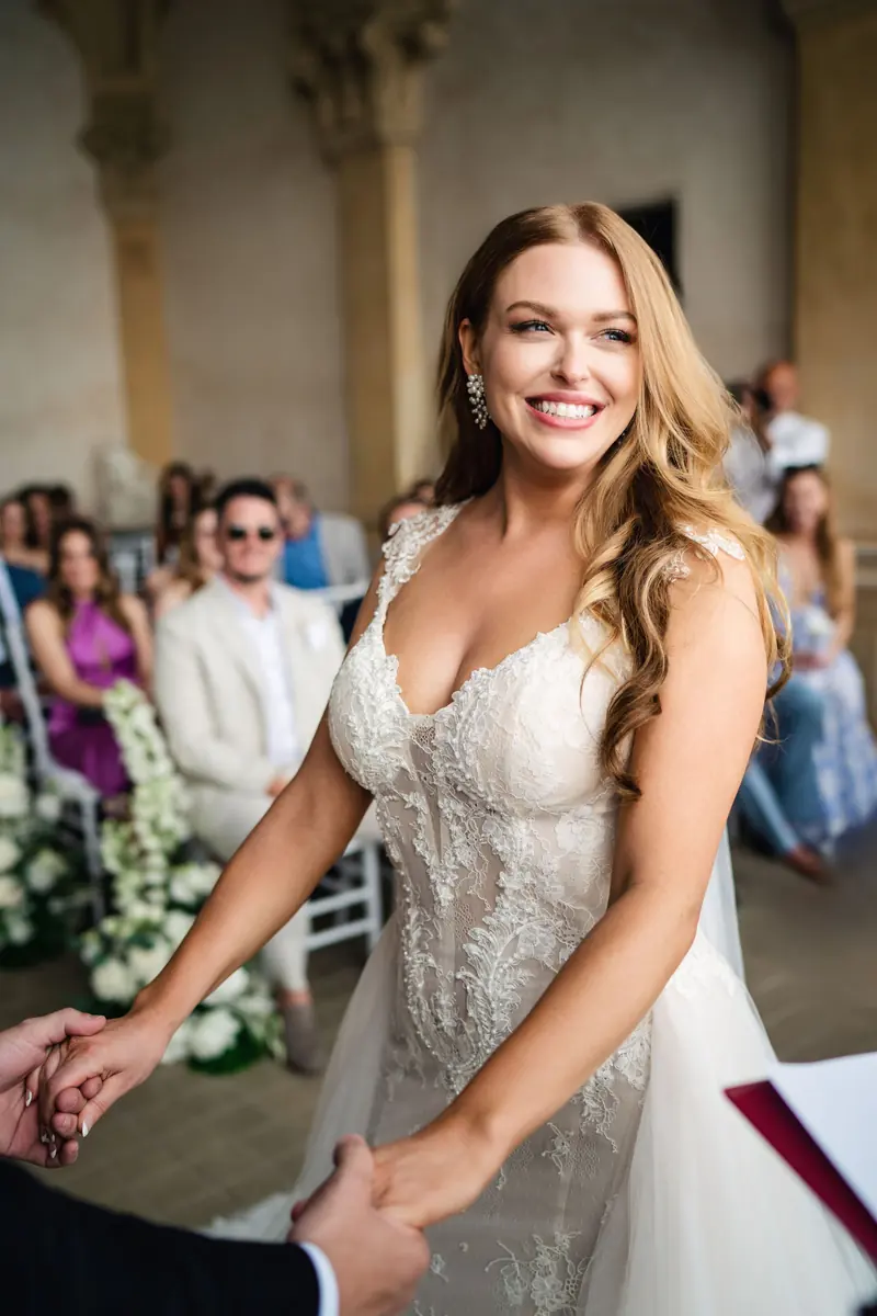 Bride smiling during the ceremony on Isola del Garda