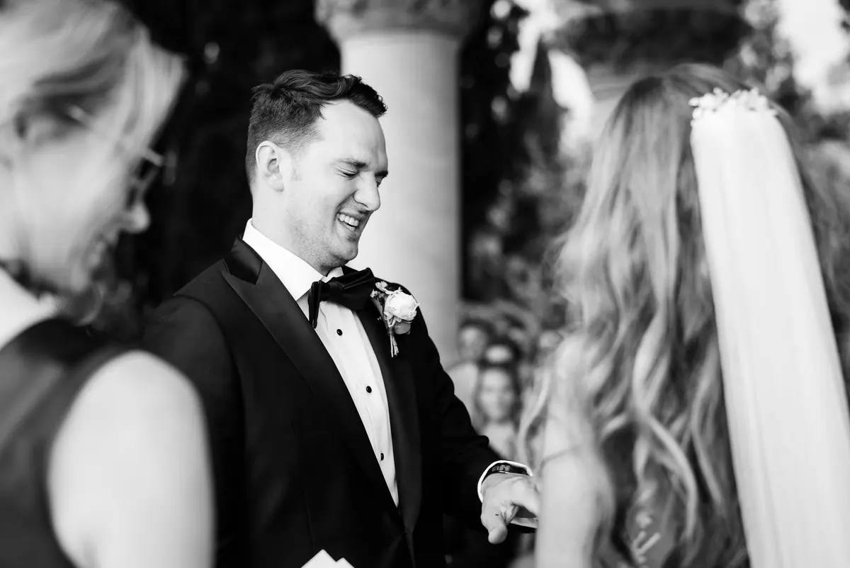 Drew smiling at Sara through her veil, in black and white