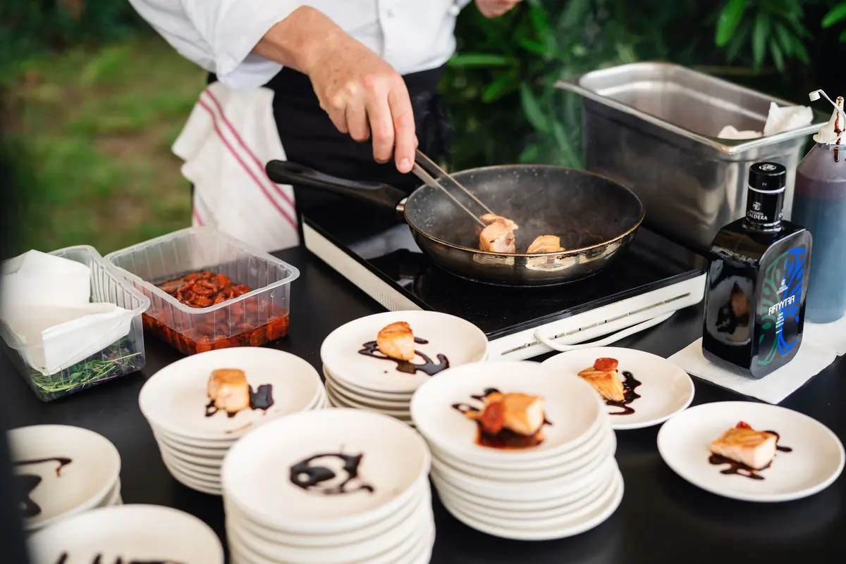 A chef cooking at the aperitivo food station
