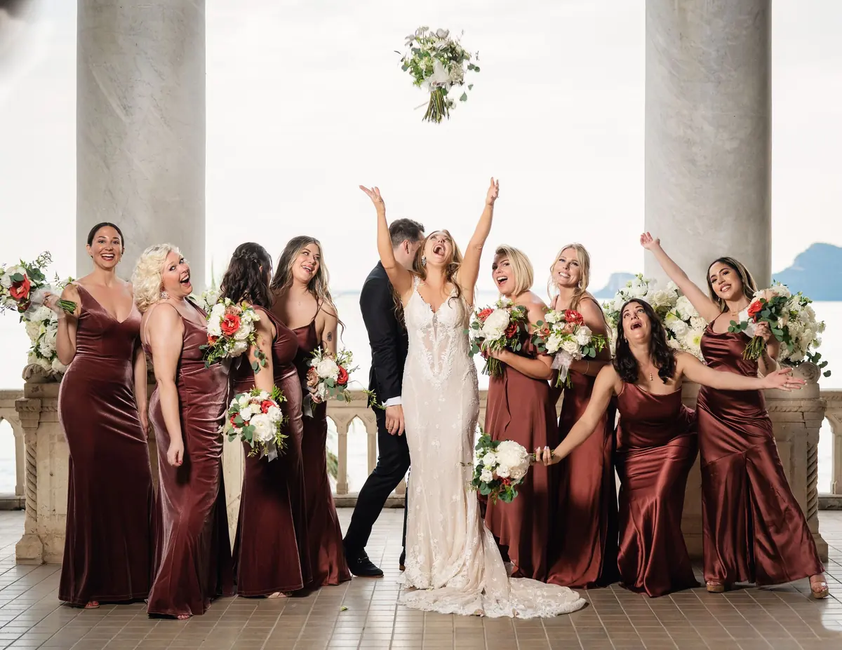 Bouquets thrown in the air by Sara and her bridesmaids