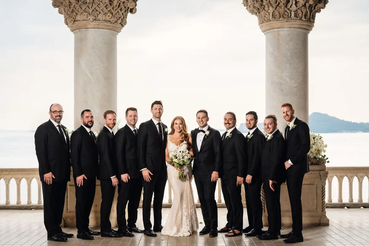 Drew and his groomsmen with Sara on the terrace