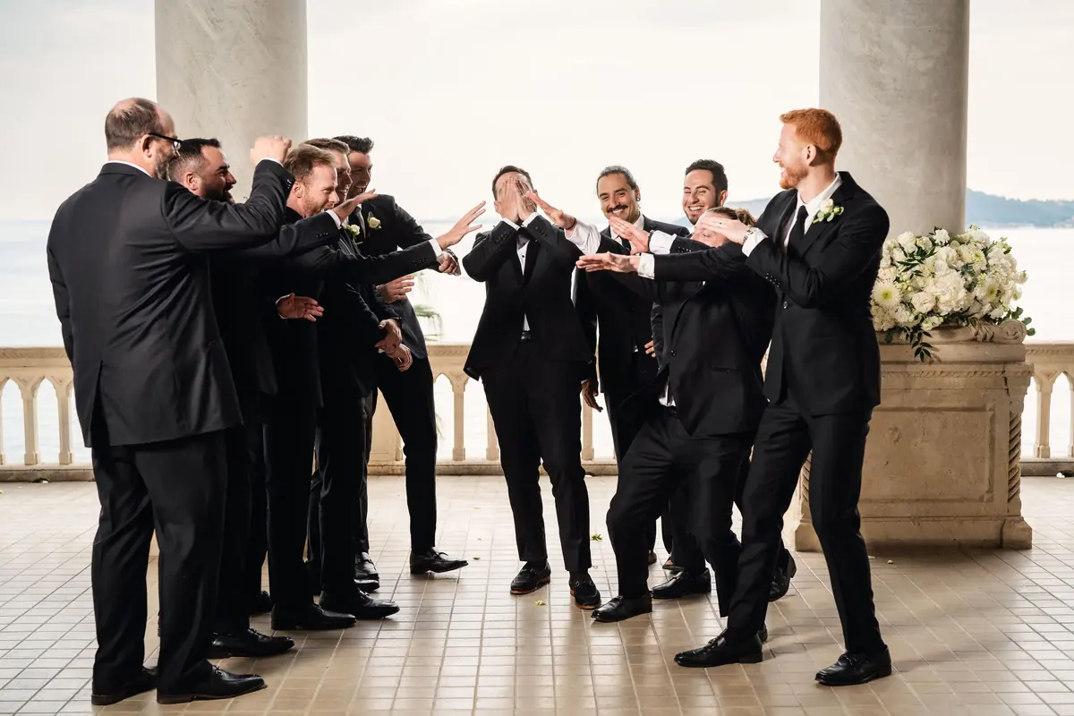 Drew's groomsmen fooling around on the terrace
