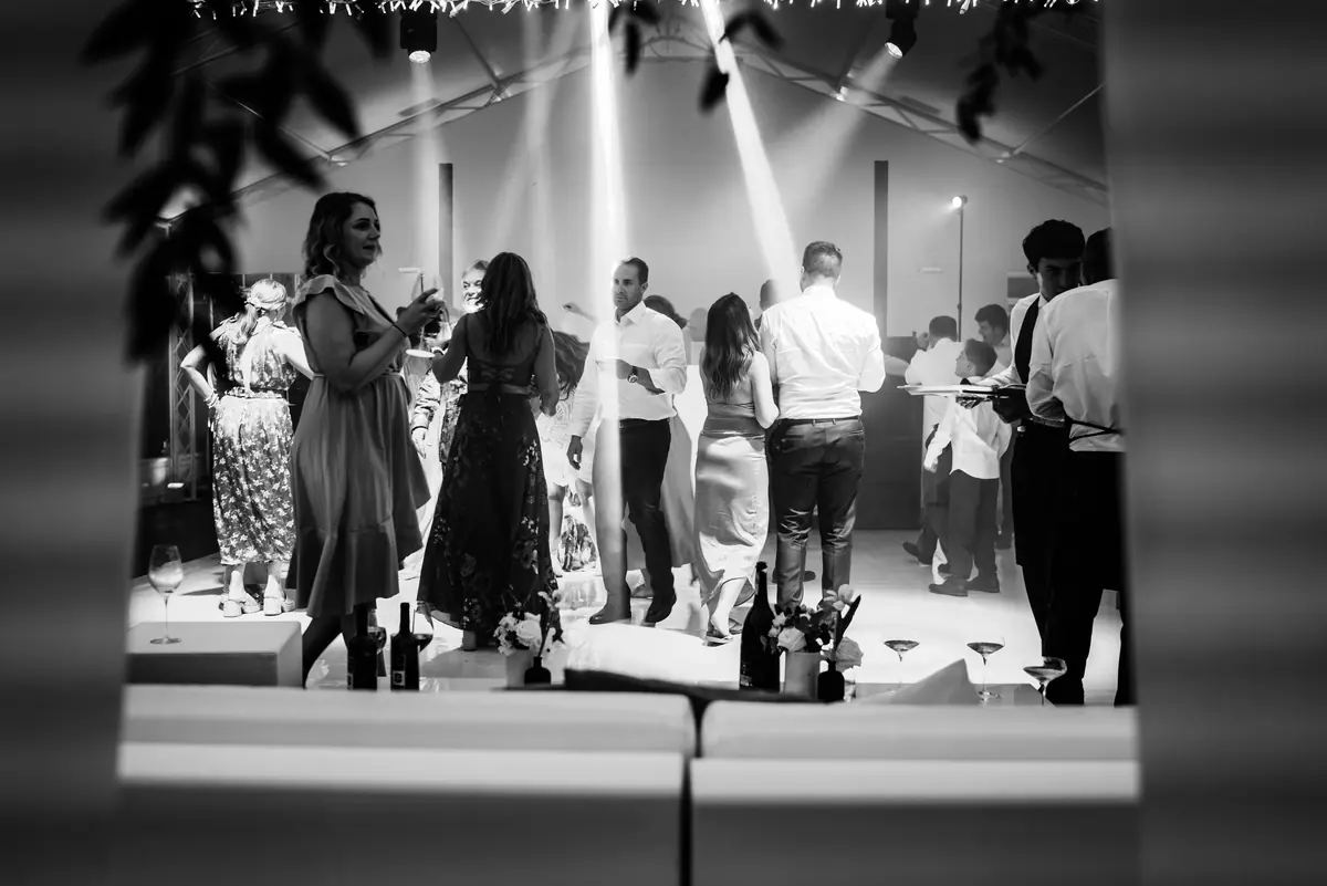 The dance floor seen through a gap, in black and white
